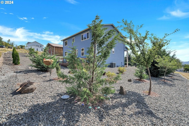 view of side of property with central AC unit