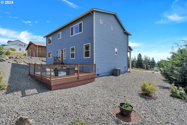 back of property with cooling unit and a deck