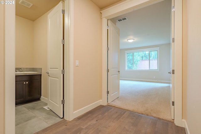 hall featuring light wood-type flooring