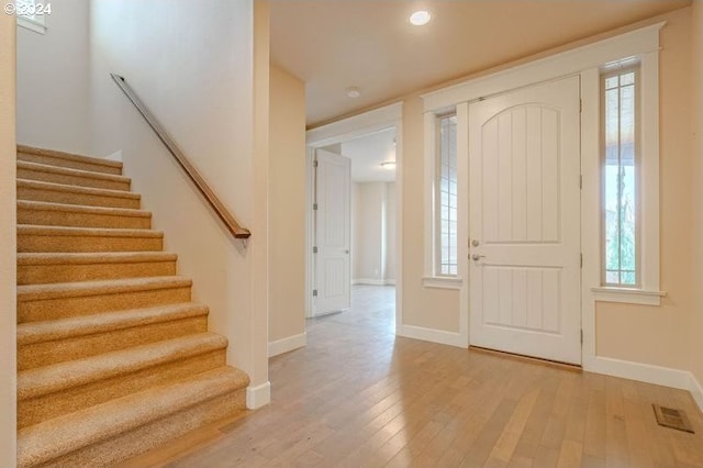 entrance foyer featuring a healthy amount of sunlight and light wood-type flooring