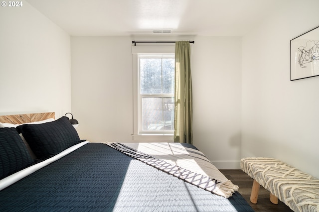 bedroom featuring dark hardwood / wood-style flooring