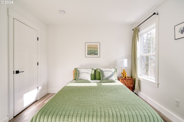 bedroom featuring hardwood / wood-style flooring