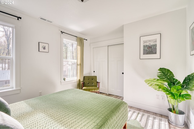 bedroom featuring a closet and hardwood / wood-style flooring