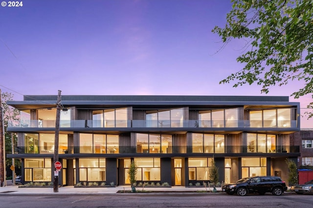 view of outdoor building at dusk