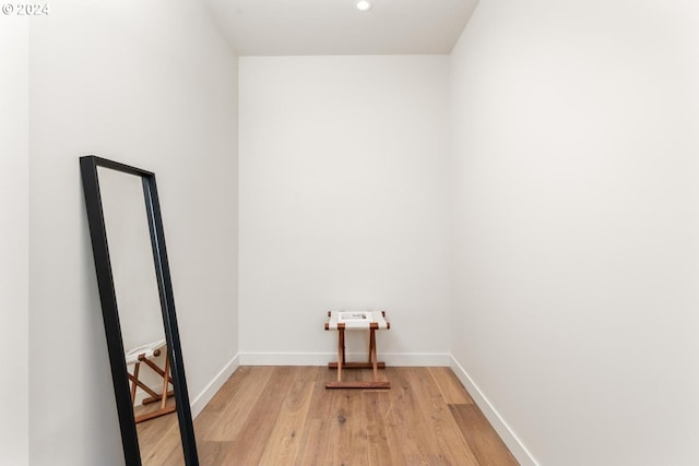 laundry area with light wood-type flooring