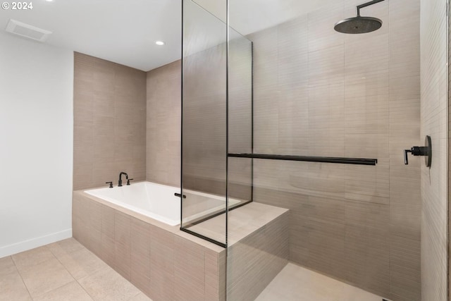 bathroom featuring shower with separate bathtub and tile patterned floors