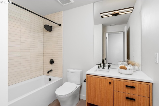 full bathroom with vanity, toilet, and tiled shower / bath