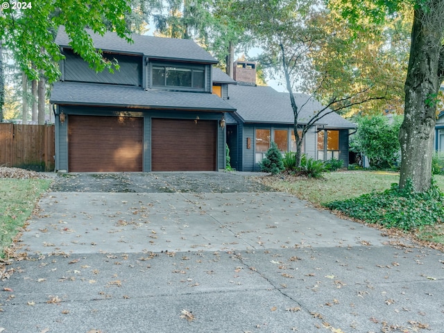 front facade with a garage