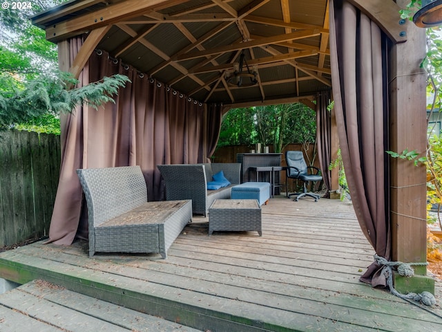 wooden terrace featuring a gazebo