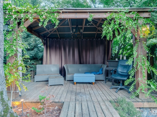 wooden deck with a gazebo and an outdoor living space