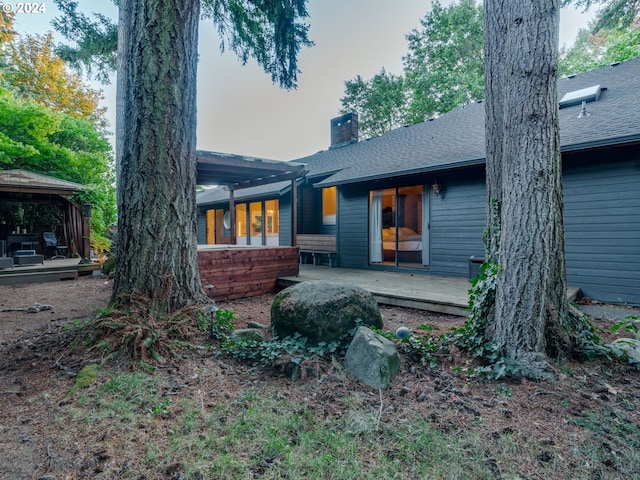 back of property featuring a gazebo and a patio