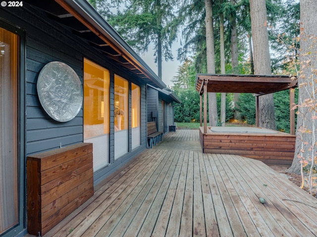 wooden terrace featuring a hot tub