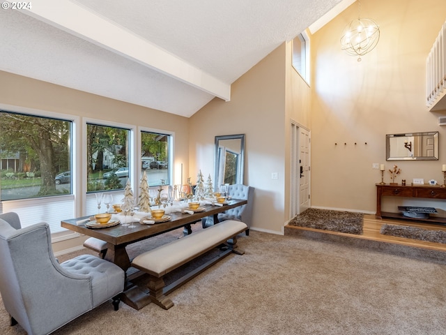 carpeted dining room featuring beamed ceiling, a chandelier, and high vaulted ceiling