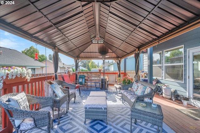 wooden terrace featuring a gazebo and outdoor lounge area