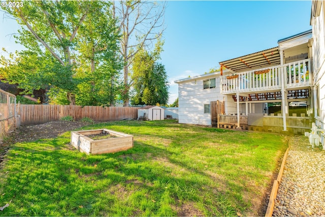 view of yard featuring a wooden deck and a storage unit