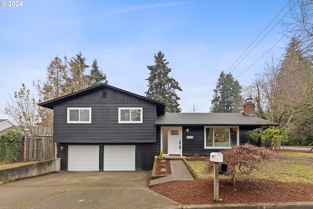 split level home featuring a garage