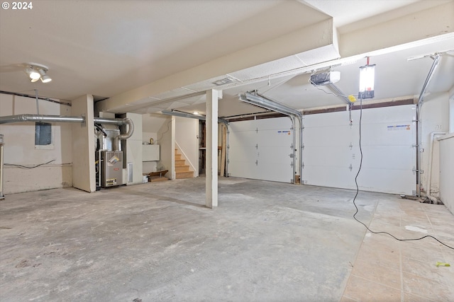 garage with heating unit and a garage door opener