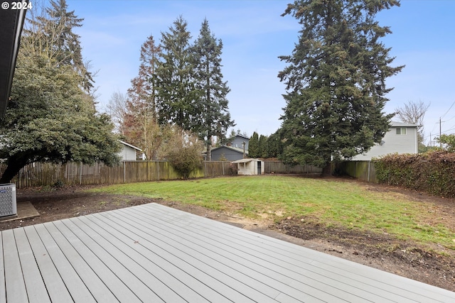 wooden terrace with a yard