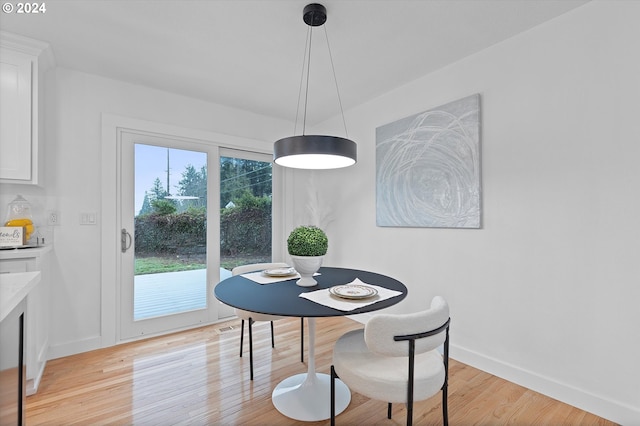 dining area with light hardwood / wood-style flooring