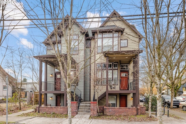 view of front of house featuring a balcony