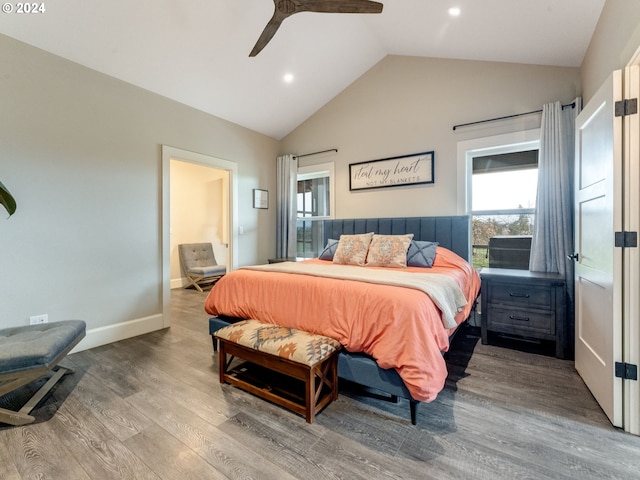 bedroom with hardwood / wood-style flooring, ceiling fan, and vaulted ceiling