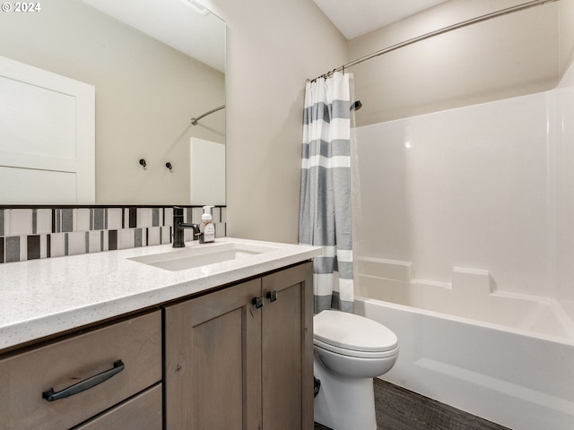 full bathroom featuring vanity, backsplash, hardwood / wood-style flooring, toilet, and shower / bathtub combination with curtain