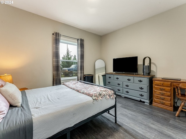 bedroom with hardwood / wood-style floors