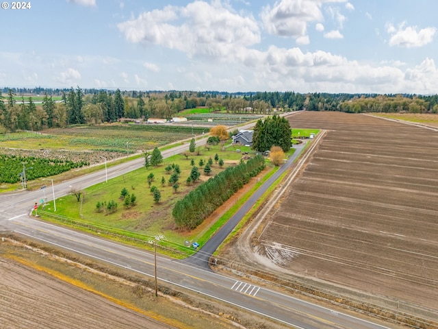 birds eye view of property featuring a rural view