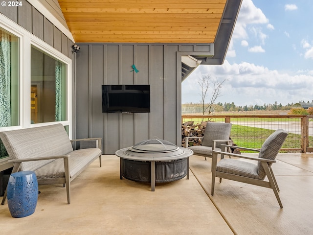 view of patio / terrace featuring an outdoor fire pit