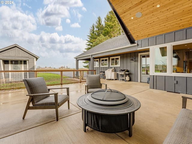 view of patio featuring a grill