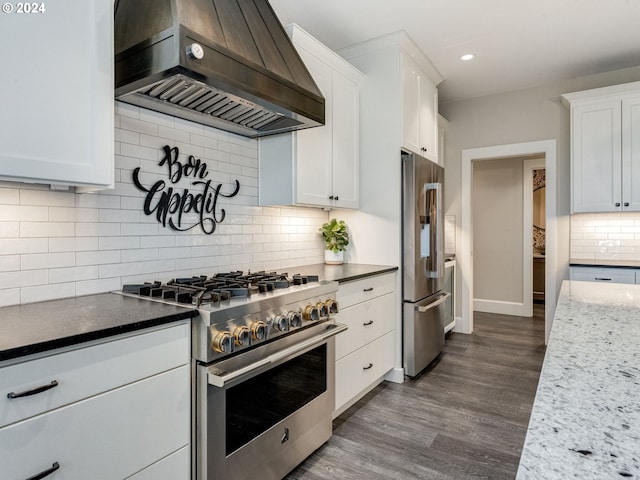 kitchen featuring white cabinetry, high end appliances, and custom exhaust hood