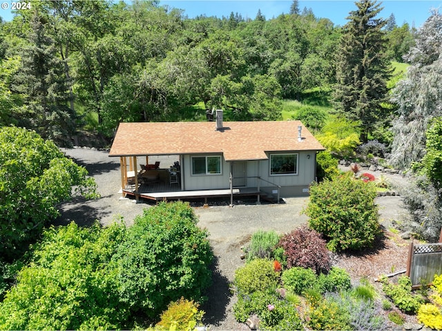 1262 Kester Rd, Roseburg, OR 97470 - rear view of property with a deck, board and batten siding, roof with shingles, and a forest view