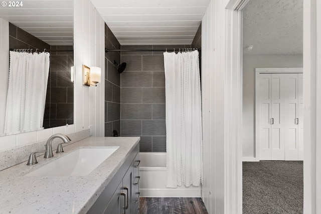 bathroom featuring vanity and shower / bath combo with shower curtain