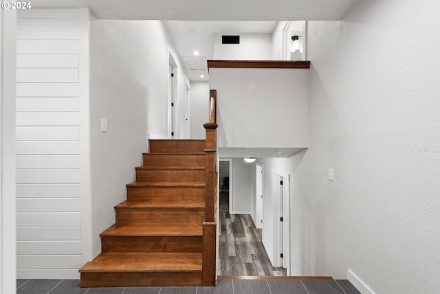 stairs with hardwood / wood-style floors