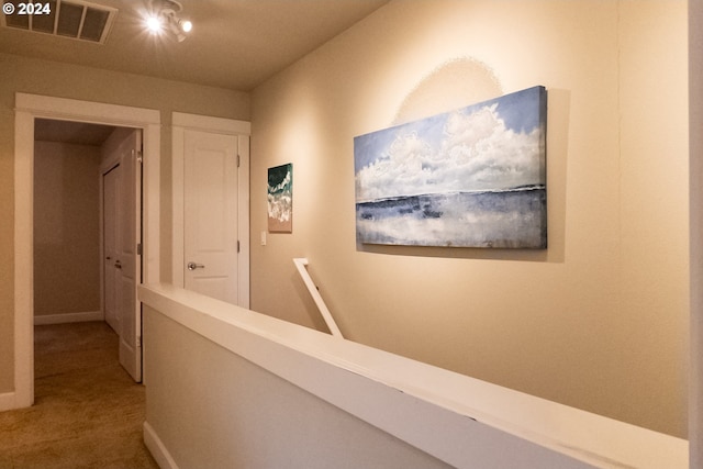 corridor with carpet floors