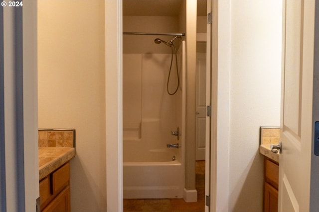 bathroom with tub / shower combination and vanity