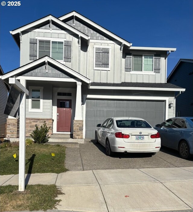 view of front facade featuring a front yard and a garage