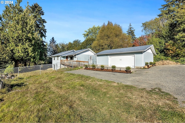 exterior space with a garage and a yard