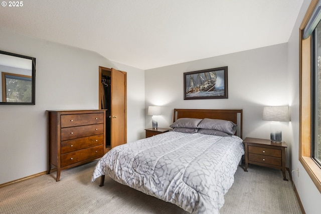 bedroom with light colored carpet