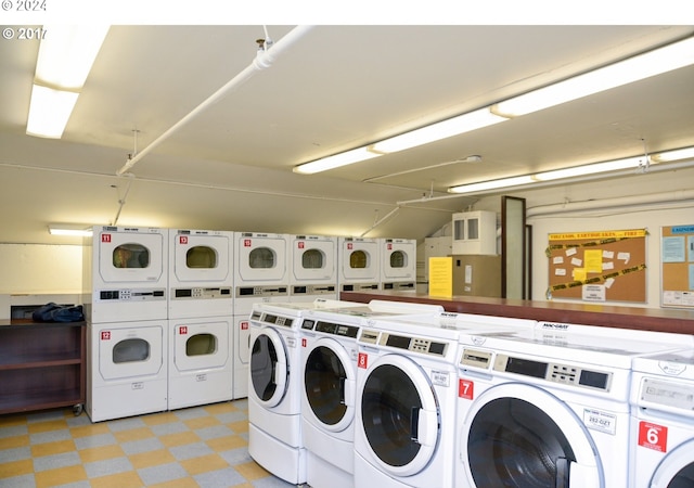 clothes washing area with stacked washer / drying machine and washer and dryer