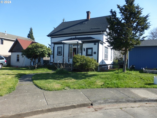 view of front of home with a front yard