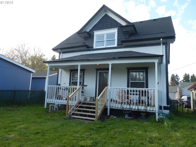 view of front of home with a front lawn and a porch