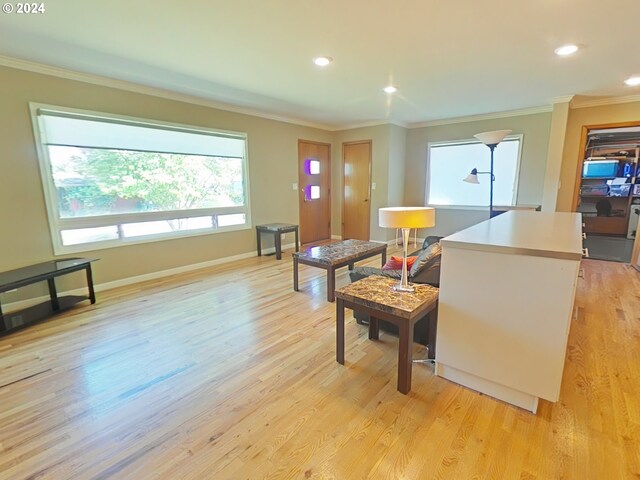 living room featuring light wood-type flooring and crown molding