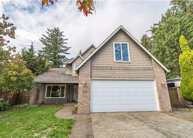 view of front of house with a front lawn and a garage