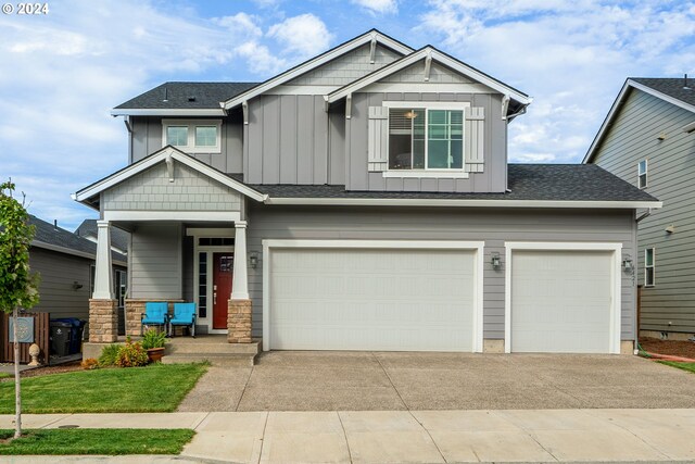 craftsman house with a garage