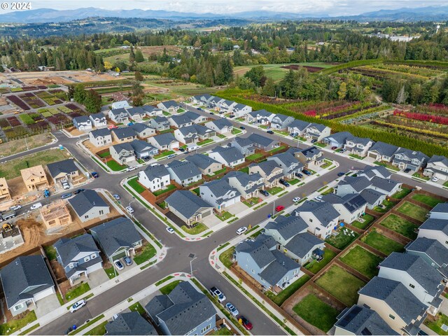 birds eye view of property featuring a mountain view