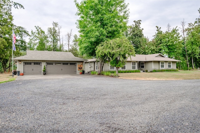 single story home with an attached garage and driveway