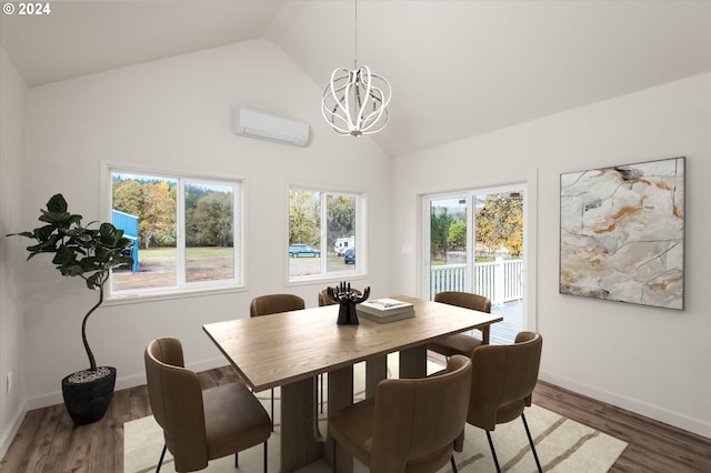 dining space featuring an AC wall unit, a notable chandelier, dark hardwood / wood-style floors, and high vaulted ceiling