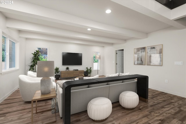 living room featuring beam ceiling and dark hardwood / wood-style floors