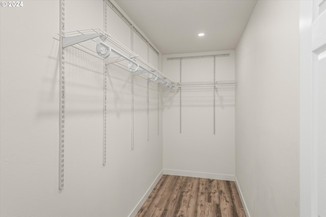 walk in closet featuring hardwood / wood-style flooring